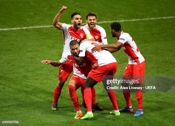 Kylian Mbappe of AS Monaco celebrates with Radamel Falcao after scoring their second goal during the UEFA Champions League Round of 16 first leg...