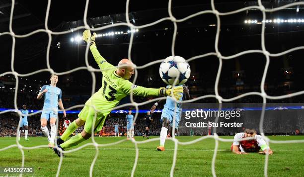Radamel Falcao of AS Monaco scores the first Monaco goal past Willy Caballero during the UEFA Champions League Round of 16 first leg match between...