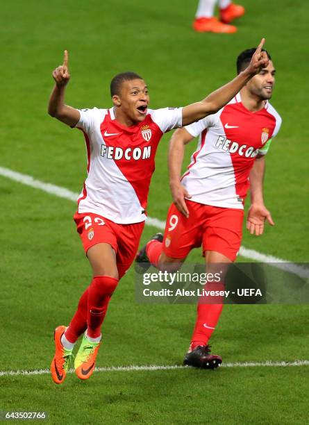 Kylian Mbappe of AS Monaco celebrates with Radamel Falcao after scoring their second goal during the UEFA Champions League Round of 16 first leg...