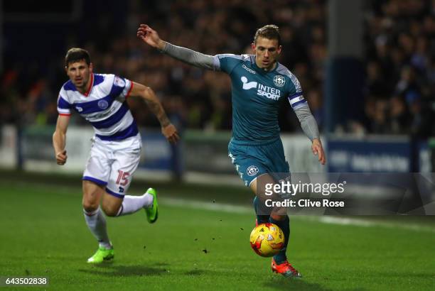 Stephen Warnock of Wigan Athletic takes on Pawel Wszolek of QPR during the Sky Bet Championship match between Queens Park Rangers and Wigan Athletic...