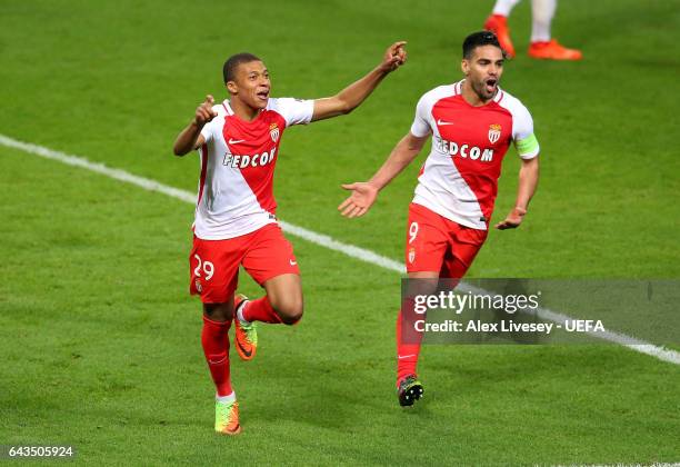 Kylian Mbappe of AS Monaco celebrates with Radamel Falcao after scoring their second goal during the UEFA Champions League Round of 16 first leg...