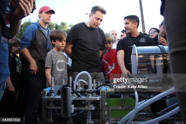 Elon Musk examines a student team's pod on January 29, 2017. To accelerate the development of a functional Hyperloop prototype, a high speed...