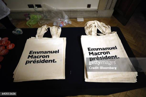 Tote bags sit on a desk before Emmanuel Macron, French presidential candidate, not pictured, speaks at a campaign meeting with French expatriates at...