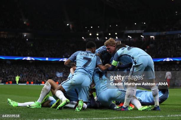 Leroy Sane of Manchester City celebrates with his team-mates after scoring his team's fifth goal to make the score 5-3 during the UEFA Champions...