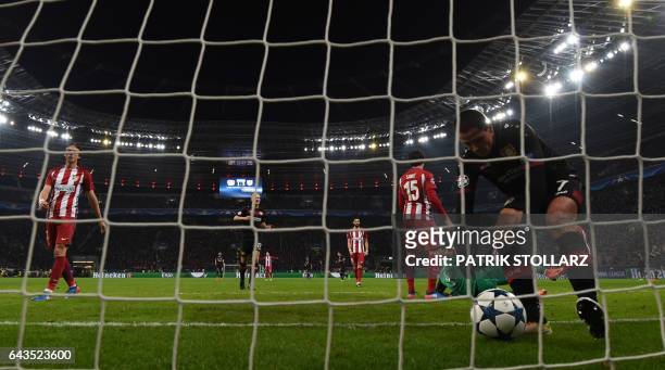 Leverkusen's Mexican striker Javier "Chicharito" Hernandez retrieves the ball after Atletico Madrid's Montenegrin defender Stefan Savic scored an own...