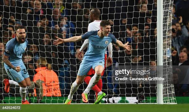 John Stones of Manchester City celebrates as he scores their fourth goal during the UEFA Champions League Round of 16 first leg match between...