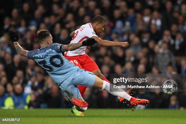 Kylian Mbappe of Monaco is challenged by Nicolas Otamendi of Manchester City during the UEFA Champions League Round of 16 first leg match between...