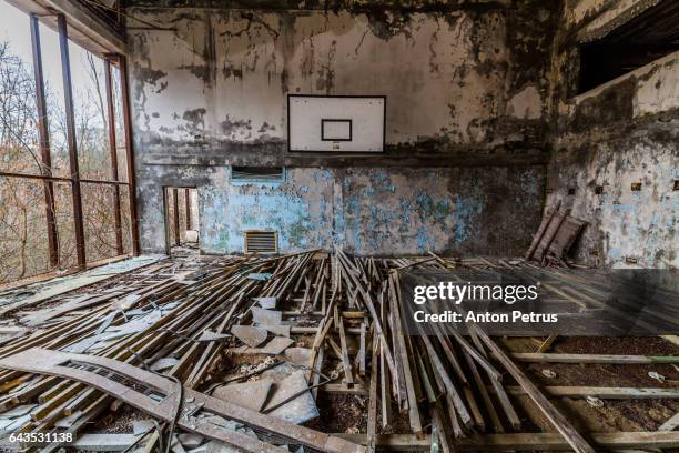 basketball court in an abandoned school. prypiat, ukraine - chernobyl 1986 stock pictures, royalty-free photos & images