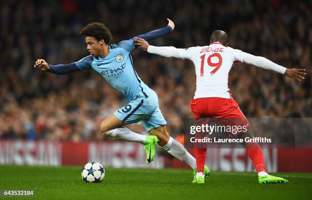 Leroy Sane of Manchester City evades Djibril Sidibe of AS Monaco during the UEFA Champions League Round of 16 first leg match between Manchester City...