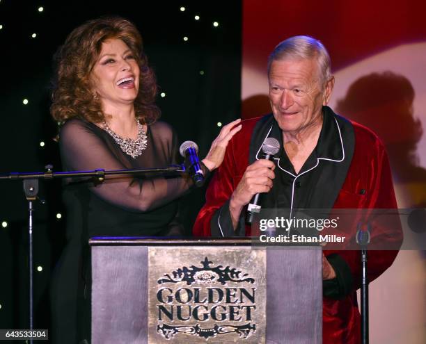 Impersonators Vera Novak of California as Sophia Loren and George Kane of Florida as Hugh Hefner present an award during The Reel Awards 2017 at the...