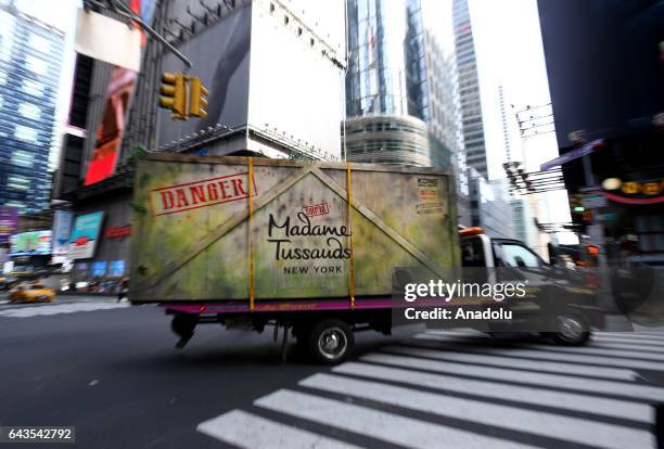 The enormous animatronic Kong head, made from over 350 square feet of specialist faux hair, is carried in a huge box on a lorry as it is taken to the...