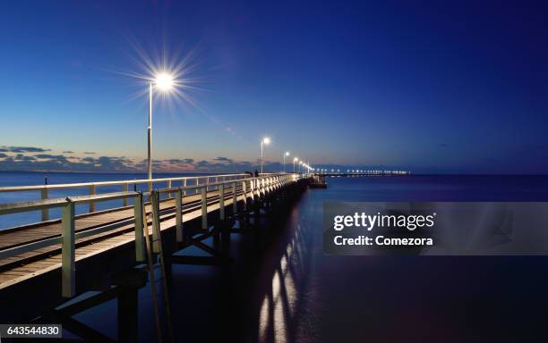 busselton jetty at night, australia - busselton jetty stock pictures, royalty-free photos & images