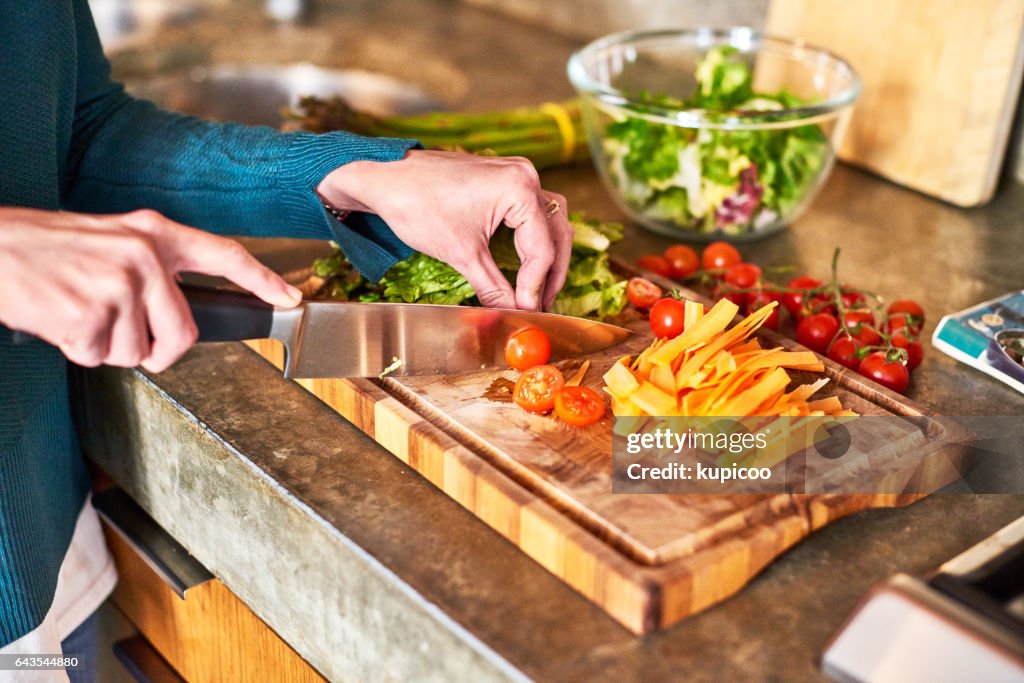 Carefully preparing her ingredients