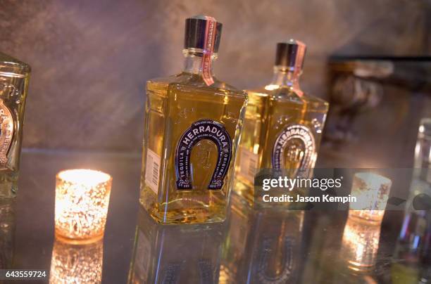 View of Herradura Reposado bottles at Tequila Herradura premieres 'Luck Is Earned' on National Margarita Day eve featuring a live performance and...