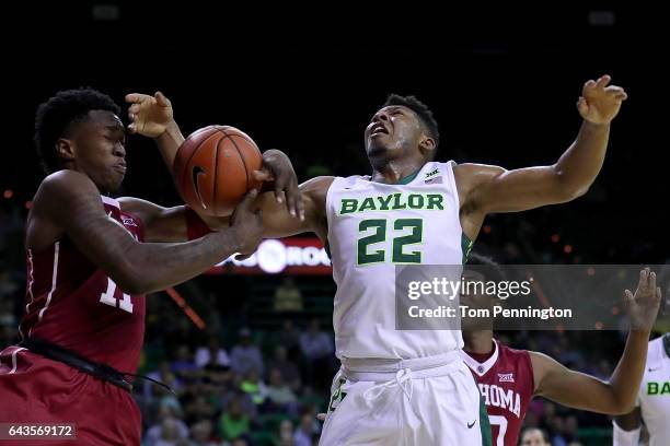 Kristian Doolittle of the Oklahoma Sooners fouls King McClure of the Baylor Bears in the second half at Ferrell Center on February 21, 2017 in Waco,...