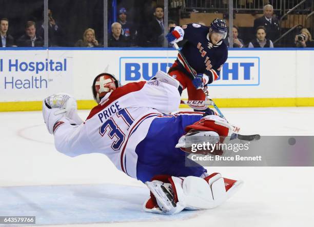 Carey Price of the Montreal Canadiens makes the diving save in the closing seconds of overtime against J.T. Miller of the New York Rangers at Madison...