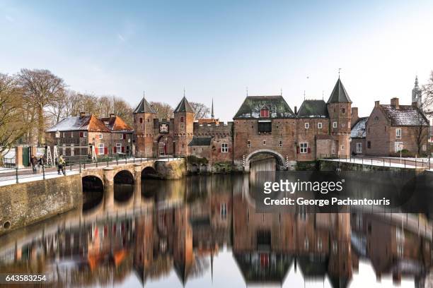 medieval gate of koppelpoort in amersfoort, netherlands - utrecht stock pictures, royalty-free photos & images