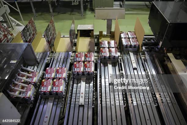 Cans of Asahi Super Dry beer are packed on the production line of the Asahi Kanagawa Brewery, operated by Asahi Breweries Ltd., a unit of Asahi Group...