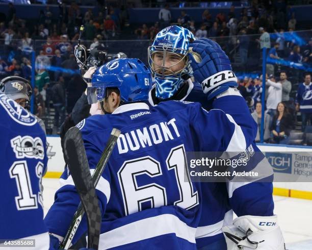 Gabriel Dumont and goalie Ben Bishop of the Tampa Bay Lightning celebrate the win against the Edmonton Oilers at Amalie Arena on February 21, 2017 in...