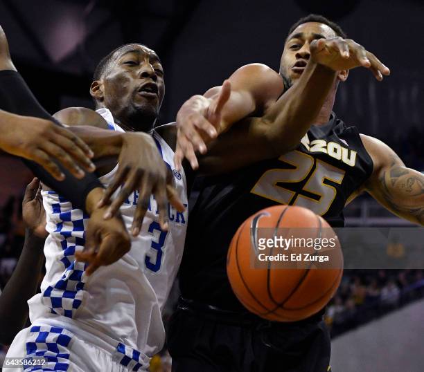 Edrice Adebayo of the Kentucky Wildcats and Russell Woods of the Missouri Tigers battle for a rebound during the first half at Mizzou Arena on...