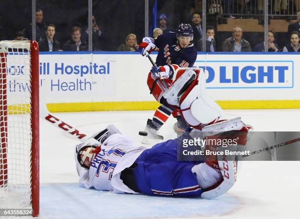 Carey Price of the Montreal Canadiens makes the diving save in the closing seconds of overtime against J.T. Miller of the New York Rangers at Madison...