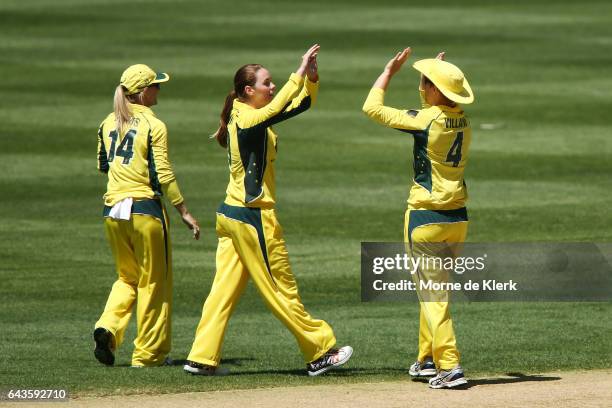 Amanda-Jade Wellington of Australia celebrates with teammates after getting the wicket of Liz Perry of New Zealand during the Women's Twenty20...