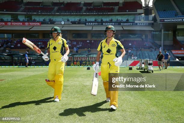 Meg Lanning and Beth Mooney of Australia walks out to bat during the Women's Twenty20 International match between the Australia Southern Stars and...