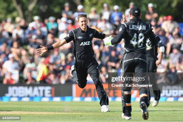 Trent Boult of New Zealand is congratulated by Tom Latham of New Zealand after dismissing AB de Villiers of South Africa during game two of the One...