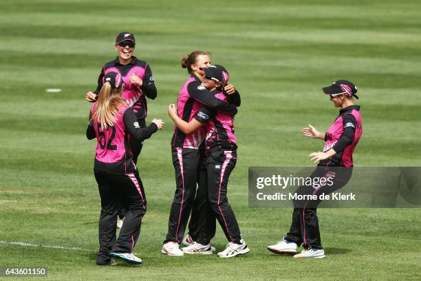 Naomi Kerr of New Zealand is congratulated by teammates after she took a catch to dismiss Alyssa Healy of Australia during the Women's Twenty20...