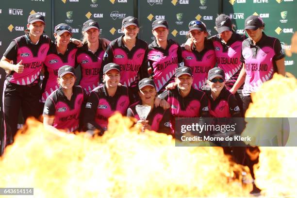 New Zealand players celebrate with their trophy after winning the series after the Women's Twenty20 International match between the Australia...