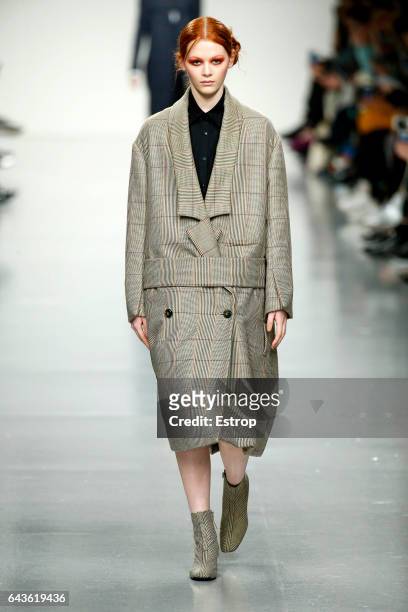Model walks the runway at the J. JS Lee show during the London Fashion Week February 2017 collections on February 21, 2017 in London, England.