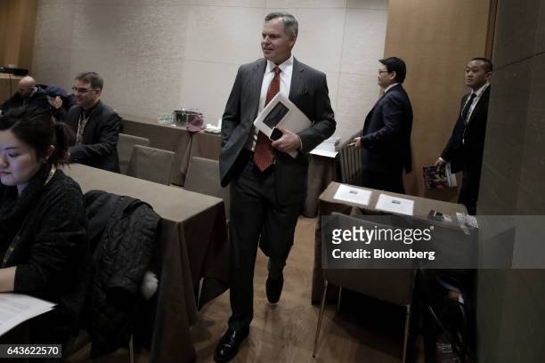 James "Jim" Murren, chairman and chief executive officer of MGM Resorts International, center, arrives for a media briefing at the 14th CLSA Japan...