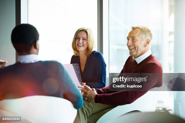 everyone is on the same page in this meeting - three people smiling stock pictures, royalty-free photos & images