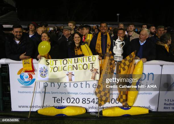 Sutton United fans with a home made FA Cup trophy and banners during The Emirates FA Cup Fifth Round match between Sutton United and Arsenal on...