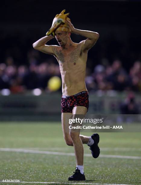 Streaker wearing a giraffe hat runs onto the pitch during The Emirates FA Cup Fifth Round match between Sutton United and Arsenal on February 20,...