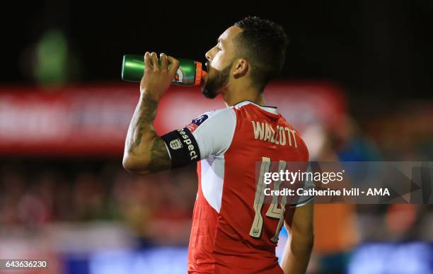 Theo Walcott of Arsenal has a drink during The Emirates FA Cup Fifth Round match between Sutton United and Arsenal on February 20, 2017 in Sutton,...