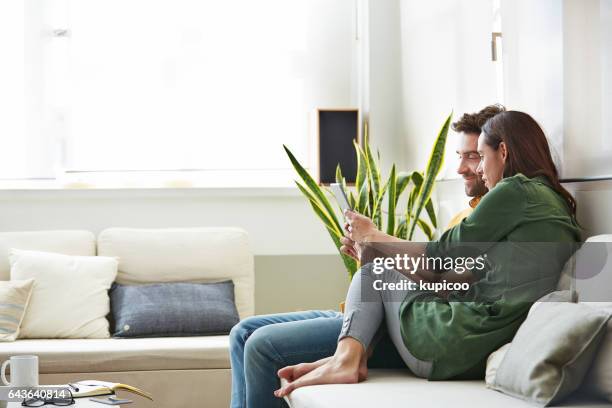 the share the same online interests - young couple happy stock pictures, royalty-free photos & images