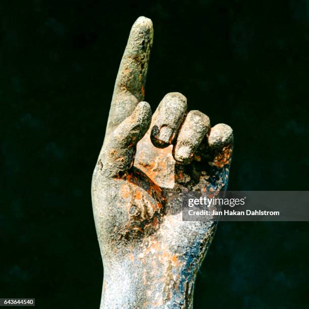 angel statue hand pointing up - angel statue stock-fotos und bilder