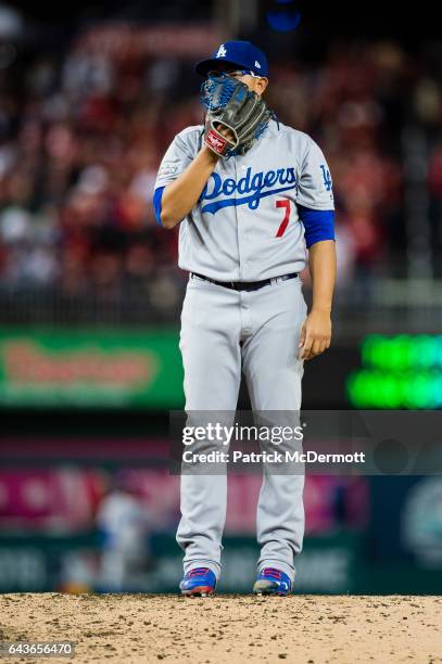 Julio Urias of the Los Angeles Dodgers pitches against the Washington Nationals in the fifth inning during game five of the National League Division...