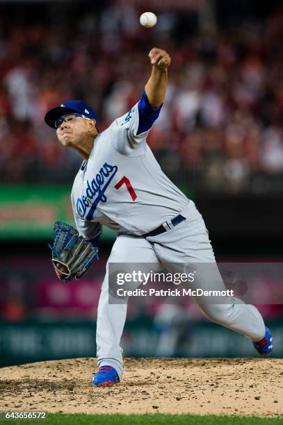 Julio Urias of the Los Angeles Dodgers pitches against the Washington Nationals in the fifth inning during game five of the National League Division...