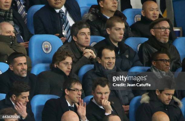 Noel Gallagher, below him Jean Sarkozy attend the UEFA Champions League Round of 16 first leg match between Manchester City FC and AS Monaco at...