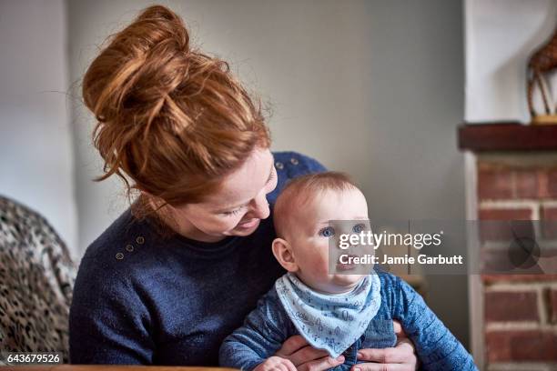 portrait of a parent and child bonding - redhead boy stock pictures, royalty-free photos & images