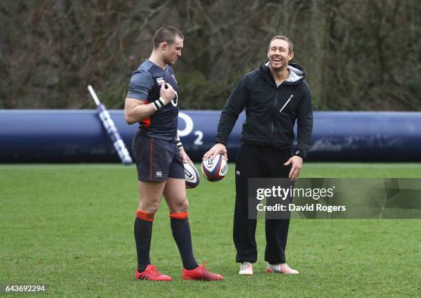 Jonny Wilkinson laughs with Mike Brown of England during an England training session at Pennyhill Park on February 22, 2017 in Bagshot, England.