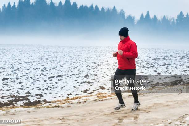 running in winter - orienteering run stock pictures, royalty-free photos & images