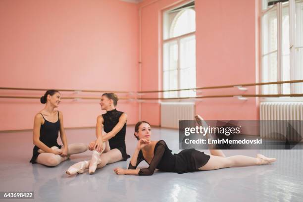 ballet dancers taking a break from ballet class. - leotard and tights stock pictures, royalty-free photos & images