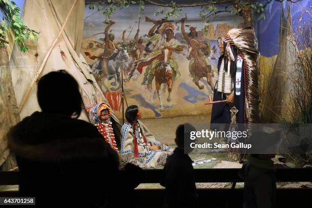 Visitors look at a diorama of American Indians inspired from the 19th-century German writer Karl May's Wild West series at the Karl May Museum on...