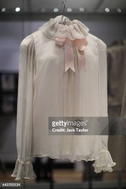 Emanuel chiffon blouse worn by Princess Diana during her first official portrait by Lord Snowdon on display at a press preview at Kensington Palace...