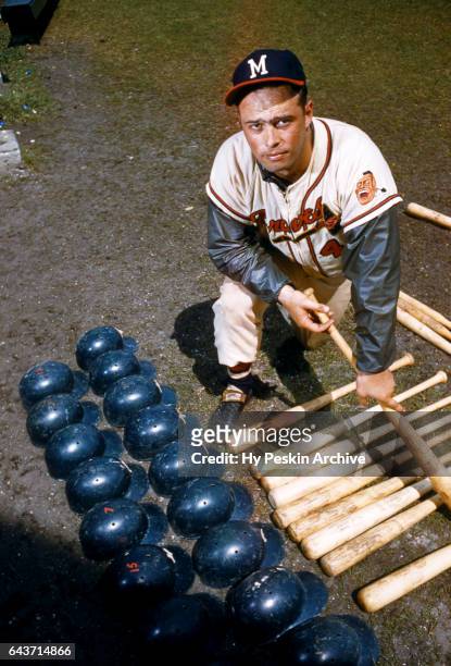 Eddie Mathews of the Milwaukee Braves poses for a portrait with helmets and baseball bats circa March, 1958 in Florida.