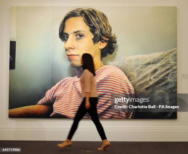 Sotheby's employee walks past Luciano II painted in 1976 by Franz Gertsch which is estimated to fetch &pound;1 000 - 2 000 at auction as part of...