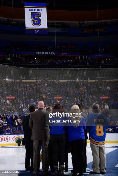 Bob Plager and his family watch as Plager's number is hung in the rafters during Plager's number retirement ceremony prior to a game between the...